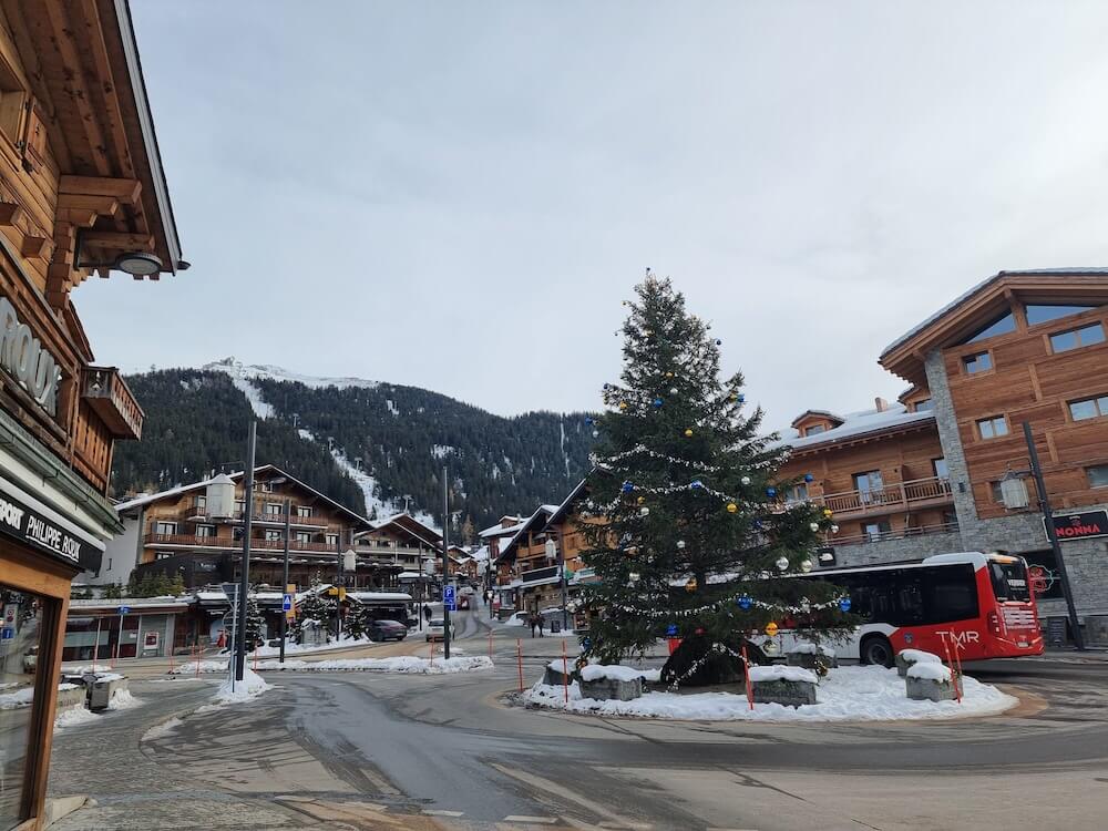 a view of verbier village with mountain in the background