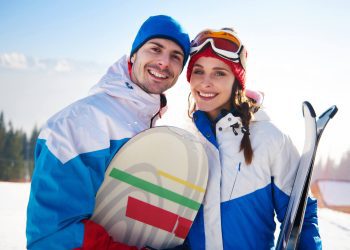 your first trip to ski resorts can be daunting - first time ski couple