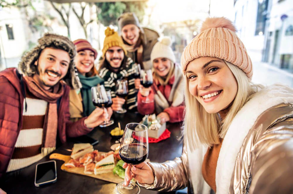 A group of skiers enjoying après ski activities in the Austrian Alps