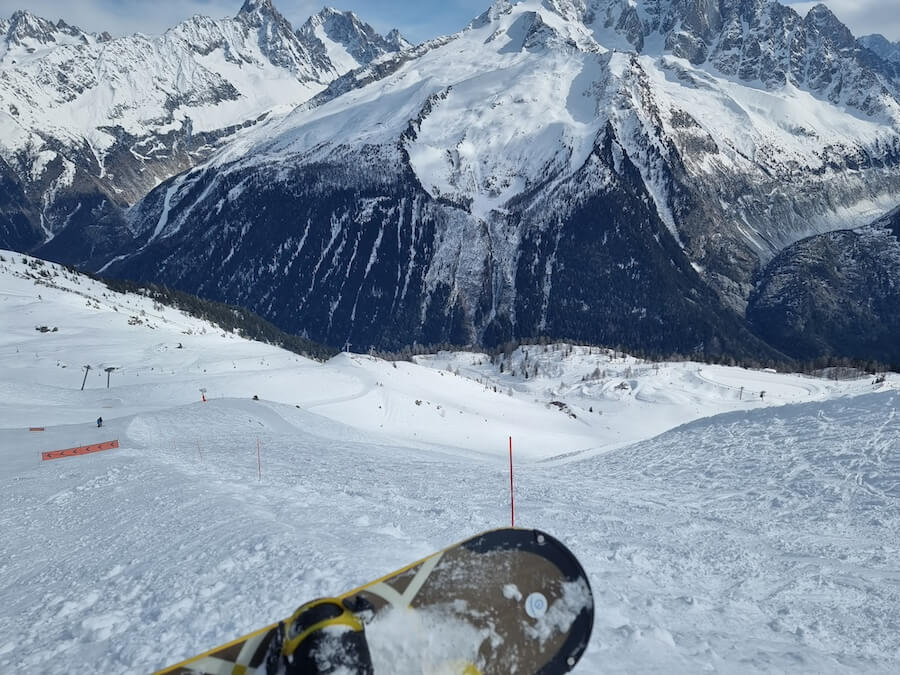 Snowboarders view of the pistes in Flegere ski resort in Chamonix