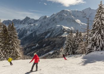 A view of skiers and snowboarders in Les Houches, France